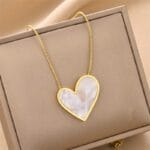 Elegant Gold Tone Heart Necklace with White Marbled Pendant