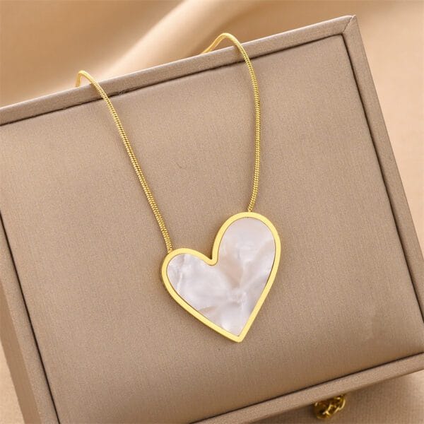 Elegant Gold Tone Heart Necklace with White Marbled Pendant