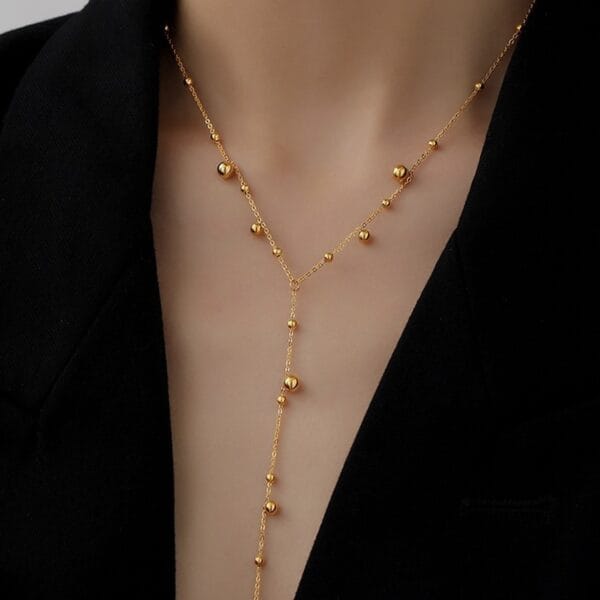 1707228239438680064 Gold Beaded Lariat Necklace | Delicate Y-Drop Chain