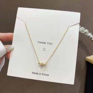 Gold Crystal Ball Pendant Necklace | White Pavé Bow Charm