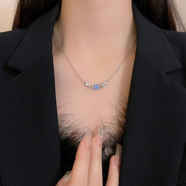 1770805004790407168 Silver Blue Stone Necklace | Delicate White Crystal Leaf Chain
