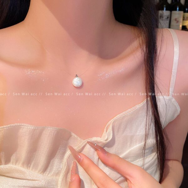 1926652047290142720 White Baroque Pearl Pendant Necklace | Floating Single Pearl Chain