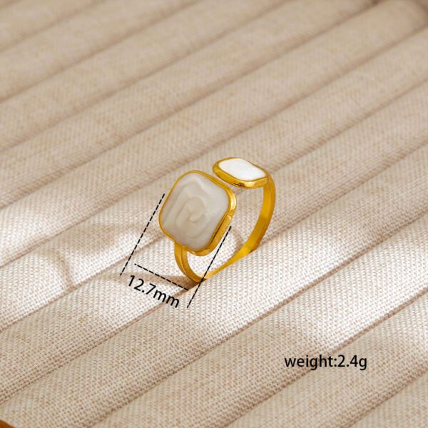 1946459247860649984 Elegant Gold Adjustable Ring with Dual White Abstract Stones