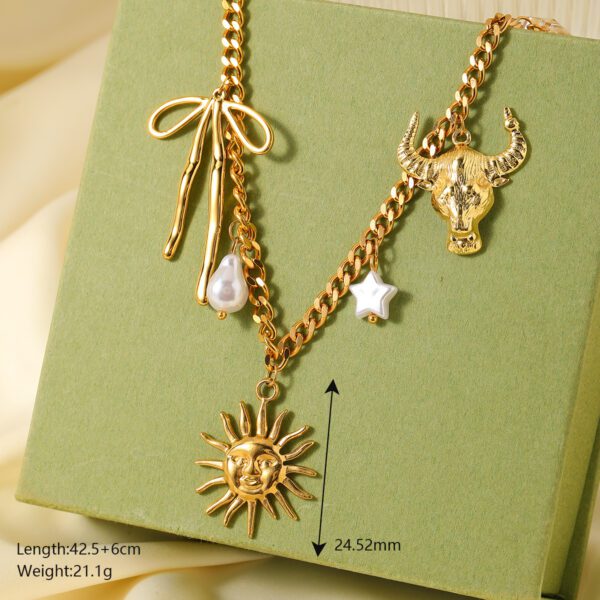 1947472620249288704 Gold Sun Face Charm Necklace | White Pearl Bull Bow Multi-Charm